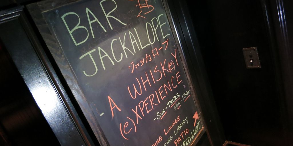 bourbon tasting event with enthusiasts in a cozy bar