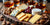 Cheese and bourbon pairing on a wooden board.