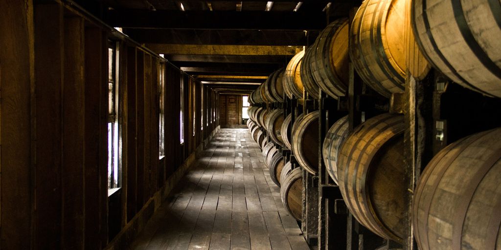 luxury bourbon tasting event with diverse people