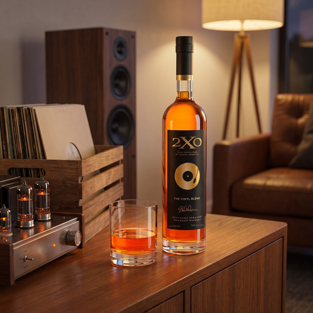 2XO The Vinyl Blend, 104 proof Kentucky straight bourbon, on a teak credenza beside a record crate and a tube amplifier