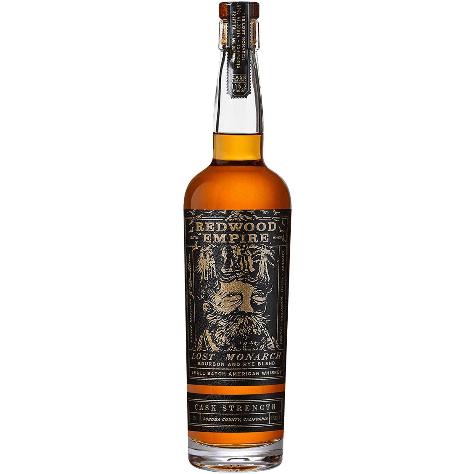 Redwood Empire Lost Monarch Cask Strength 116.2 proof on a slate bar beside a Glencairn pour, dried apricots and mint, fog in the redwoods outside